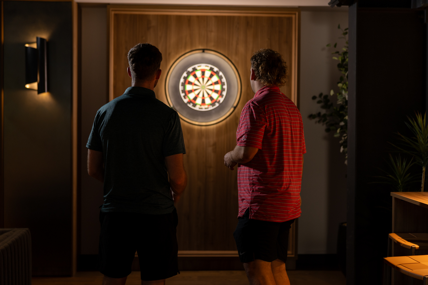 Members playing darts in The Reserve