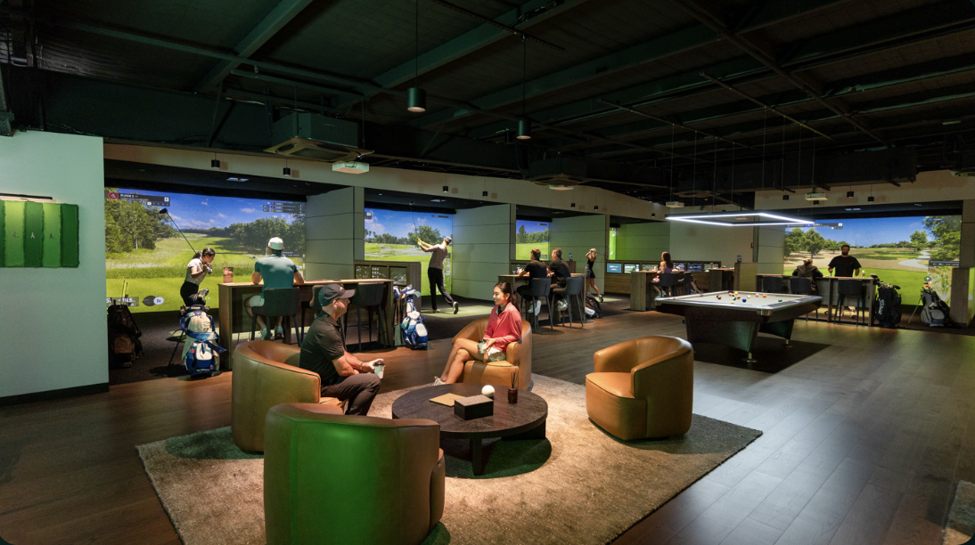 The Reserve members-only space with lounge seating and simulator bays